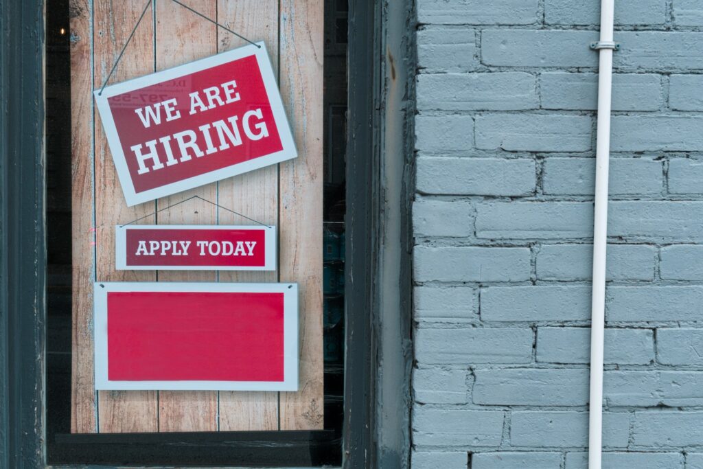image of a hiring sign outside a shop | Get a Job in Toronto