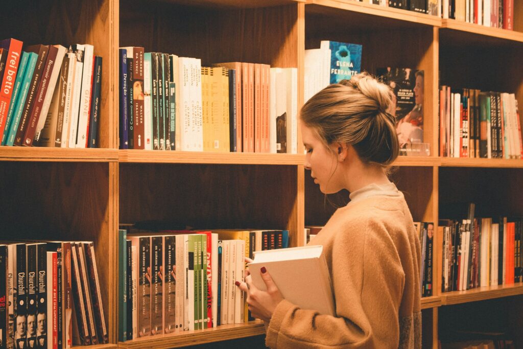 image of a female student in the library | Study Masters In Canada With Scholarship For International Students 
